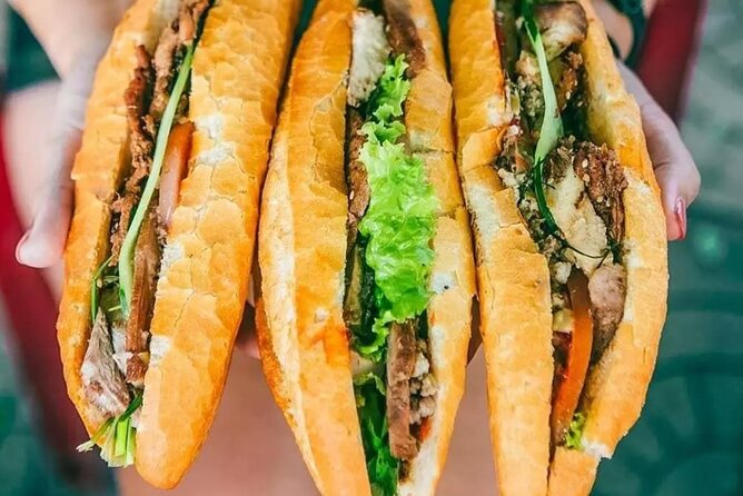 12 Tasting Street Food & Sightseeing By Scooter with Student - Starting with pho on Mac Dinh Chi Street