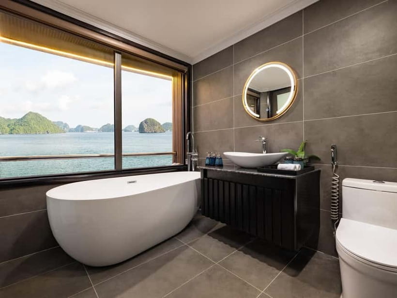 2-Day or 3-Day: Halong&Lan Ha Bay Cruise 5<em> balcony,bathtub – A comfortable ship for seeing two famous bays’ /></p>
<p><p>At about $148 per person, this cruise sits in the affordable luxury range for a multi-day Halong and Lan Ha Bay outing. You are paying not only for a bed on the water, but also for meals, entrance fees, kayaking, a bamboo boat outing, onboard insurance, and a range of planned activities.</p>
</p>
<p><p>The ship is Doria Cruise, described as a modern five-star vessel. Expect a private cabin with a balcony, bathtub, daily mineral water, and standard modern facilities. Some cabins may receive a free upgrade if space allows, and double-bed rooms can include fresh fruit and simple bed decoration if requested.</p>
</p>
<p><p>I would think of the ship as <strong>comfortable and well-finished rather than ultra-luxurious</strong>. It has an outdoor swimming pool, sundeck, Jacuzzi, karaoke, and restaurant facilities. The rooms are a major reason to choose this trip over a basic day boat, especially if you want a private place to watch the karst islands slide past.</p>
</p>
<p><p>The cruise is shared, so you will follow a group schedule. That keeps the price reasonable, but it also means that swimming, kayaking, meals, and shore visits happen at set times rather than on your own timetable.</p>
</p>
<div class="twil" style="margin: 20px 0; padding: 15px 0;"><p>More Boat Tours in Hanoi</p><ul style="margin: 10px 0; padding-left: 0; list-style: none;"><li style="margin: 0 0 12px 0; padding: 0 0 12px 0; border-bottom: 1px solid #FBF0DB; line-height: 1.4;"><a href="https://vietnameseadventures.com/hanoi-ha-long-bay-day-cruise-swimming-meal-kayaking/">Hanoi: Ha Long Bay Day Cruise – Swimming, Meal, Kayaking</a><br><span style="font-size: 0.82em; color: #9F6A00;"><span style="color: #E39700;">★</span> 4.7 &nbsp;&middot;&nbsp; 7,415 reviews</span></li><li style="margin: 0 0 12px 0; padding: 0 0 12px 0; border-bottom: 1px solid #FBF0DB; line-height: 1.4;"><a href="https://vietnameseadventures.com/ninh-binh-full-day-tour-from-hanoi-to-hoa-lu-tam-coc-mua-cave-via-boat-bike/">Ninh Binh Full-Day Tour from Hanoi to Hoa Lu, Tam Coc & Mua Cave Via Boat & Bike</a><br><span style="font-size: 0.82em; color: #9F6A00;"><span style="color: #E39700;">★</span> 5.0 &nbsp;&middot;&nbsp; 4,384 reviews</span></li><li style="margin: 0; padding: 0; border-bottom: none; line-height: 1.4;"><a href="https://vietnameseadventures.com/amanda-cruise-ha-long-lan-ha-bay-all-inclusive-2d1n-3d2n/">Amanda Cruise – Ha Long, Lan Ha Bay – All Inclusive 2D1N & 3D2N</a><br><span style="font-size: 0.82em; color: #9F6A00;"><span style="color: #E39700;">★</span> 5.0 &nbsp;&middot;&nbsp; 4,358 reviews</span></li></ul></div><h2>Hanoi to Tuan Chau: a long first morning</h2>
<p><img width="487" height="650" decoding="async" src=