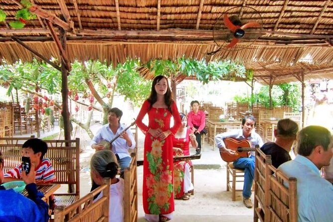 Adventure Cu Chi Tunnels and Mekong Delta Tour From HCM - Honey tea, fruit, coconut candy, and folk music