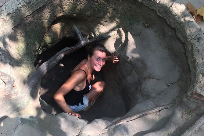 Adventure Cu Chi Tunnels and Mekong Delta Tour From HCM - Entering the Cu Chi Tunnels near Ho Chi Minh City