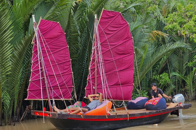 Ben Tre: Scooter, Culture, Sailboat and Mekong Food (Half Day) - A quiet sailboat on a Mekong tributary