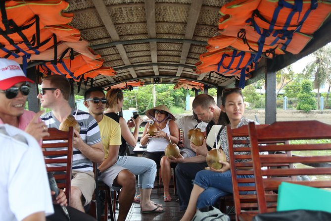 Cai Be Mekong Delta Tour: Cooking Class, Cycling & Craft Villages - Coconut candy, rice popcorn, and folk music