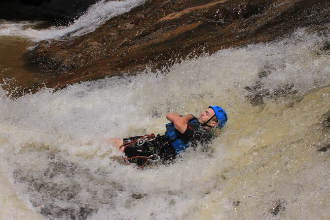 Canyoning Tour in Dalat Viet Nam - The first 18-meter rappel beside a 30-meter waterfall