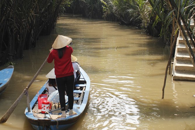 Cu Chi Tunnels and Mekong Delta 1 Day From Ho Chi Minh City - Entering the Cu Chi Tunnels