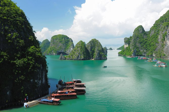 Excursion to Ha Long Bay with Titop Island and kayaking in Luon Cave - Boarding the boat and passing the limestone towers