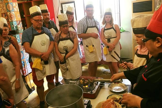 Experience half-day cooking class with market visit - Sitting down to eat what you made