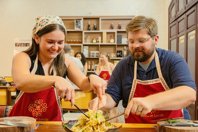 Experience Hanoi Cooking Class with Free Wine Tasting - Sitting down to eat what you prepared