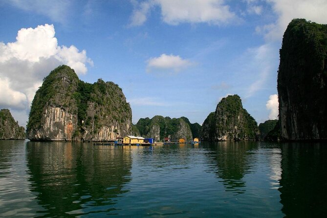 A day boat between the limestone islands of Ha Long Bay