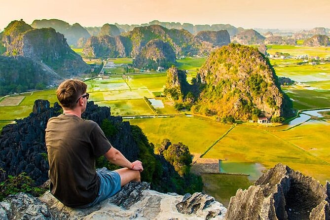 From Hanoi: Hoa Lu, Tam Coc, and Mua Cave Scenic Day Trip - Mua Cave and the climb to Ngoa Long Mountain