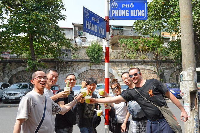 Half-Day Hanoi Food Walking Tour - Walking from the market into the Old Quarter