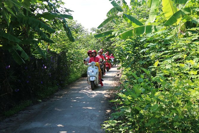 Hanoi Vespa Countryside Tour With Female Ao Dai Riders Half Day - Lunch, water, and the food side of the ride