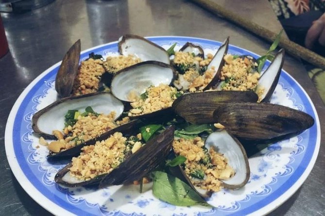 Ho Chi Minh City: Street Food Walking Tour with 12 Tastings - Stop four: Grilled banana sticky rice cake and caramel flan