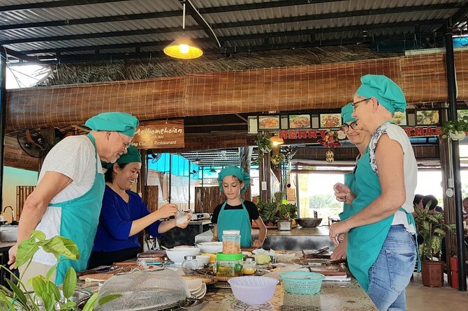 Hoi An Cooking Class With Market Tour and Bamboo Basket Boat Ride - A round boat through Bay Mau Coconut Village