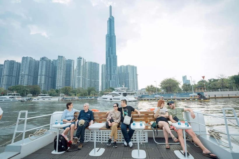 Lively Saigon River Sightseeing Cruise + Guided Walking Tour - The guides and the handoff to the boat