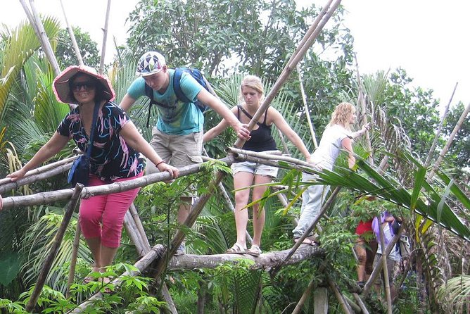 Mekong Delta Boat Tour - The hand-rowed sampan through palm-lined channels