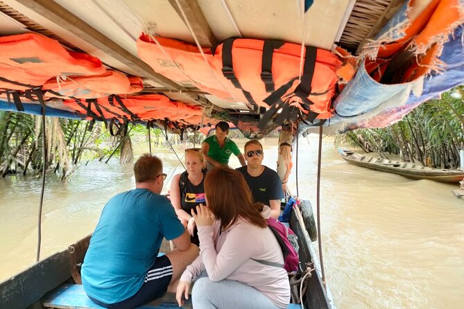 Mekong Delta Tour Daily - The hand-rowed boat through quiet canals