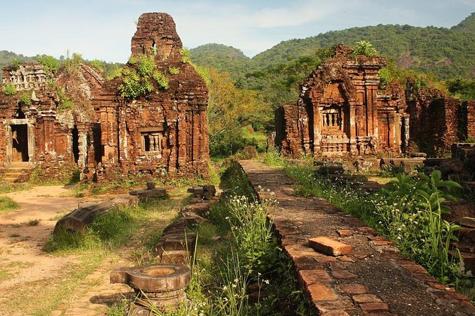 My Son Sunset Tour With Boat Trip - Reading the brick towers at My Son Sanctuary