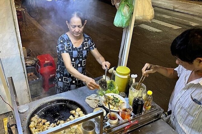 Saigon Evening Walking Street Food Tour - Bánh mì and steamed rice rolls