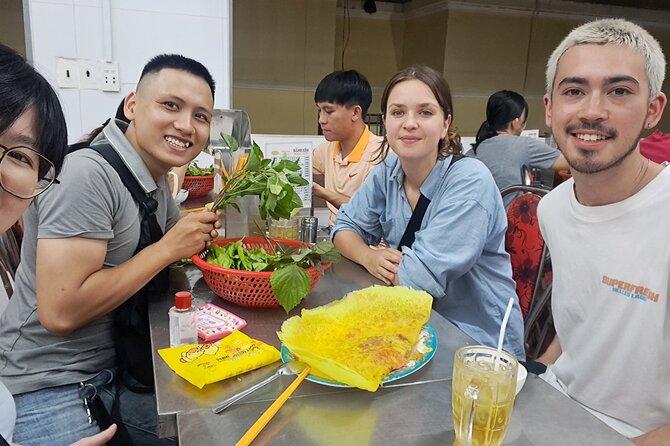Saigon Food Tour by Scooter with Eleven Tastings - Nguyen Thien Thuat apartment buildings and a bowl of bún bò Huế