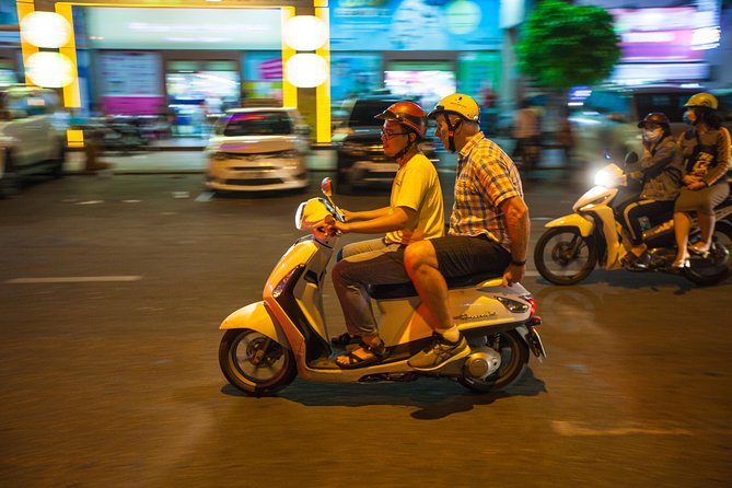 Saigon Night Street Food and City Tour on Scooter - A short city ride connects the meals