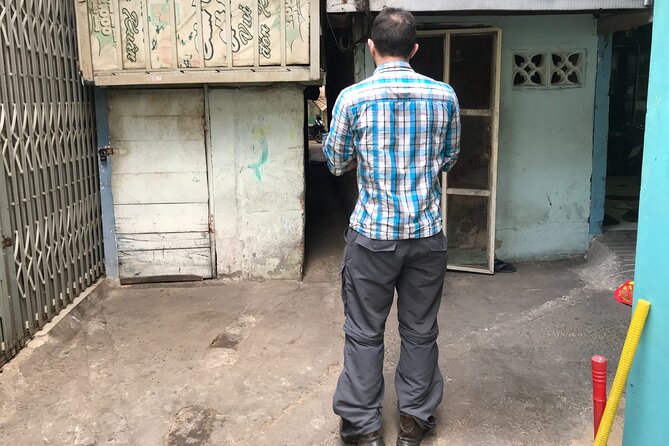 Saigon Slum tour and Saigon Chillspots by motorbike/ Aodai rider - Local food at a charity stand