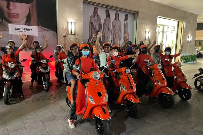 Saigon Vespa By Night Street Food With Female Riders Ao Dai - Seafood and local drinks begin the food trail