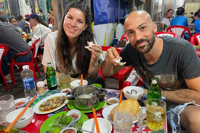 Taste of Saigon: Local Street Food Tour - Riding through Saigon with a local guide