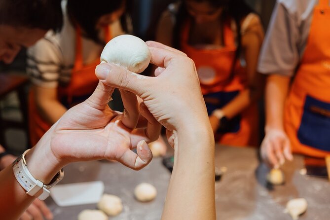 Vietnamese Bread & Brew: Banh Mi Baking Class & Specialty Coffee - Kneading dough and making the bread